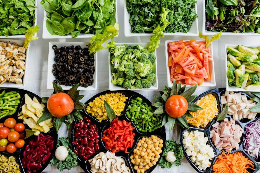 several containers with different types of vegetables and other edibles